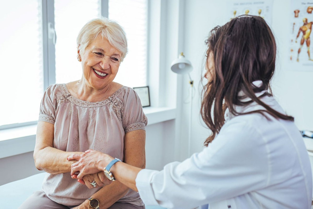 thumb arthritis surgery doctor reassuring female patient