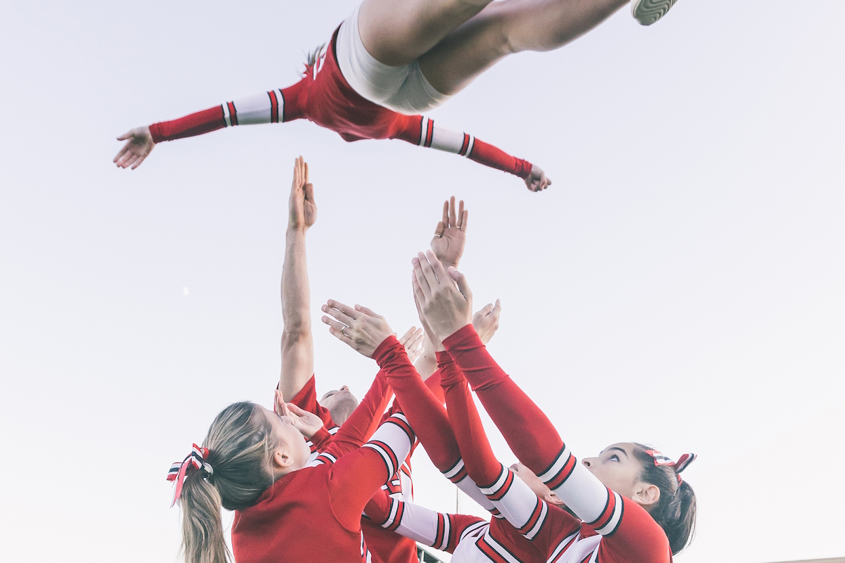 fall sports hand injury cheerleaders performing stunts